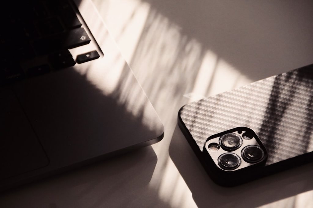 a-laptop-computer-sitting-on-top-of-a-white-table-jebuvtgu9uq